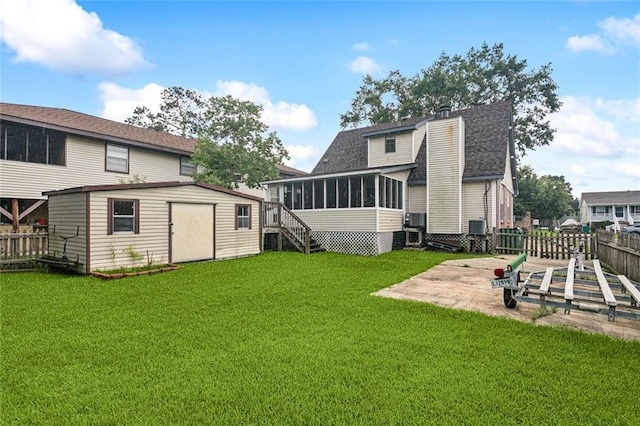 3109 Bayou View Pl, Slidell, LA 70458 - rear view of property with a sunroom, a patio area, a shed, roof with shingles, and a chimney