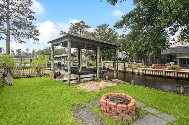 3109 Bayou View Pl, Slidell, LA 70458 - dock area featuring a fire pit, a lawn, a water view, and boat lift