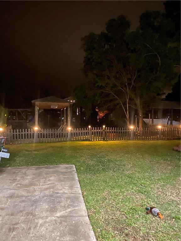 3109 Bayou View Pl, Slidell, LA 70458 - yard at twilight with a patio