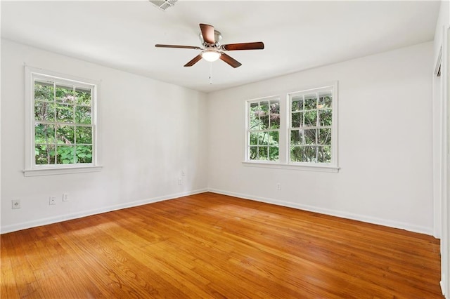 108 N Dr, Covington, LA 70433 - unfurnished room featuring plenty of natural light, light wood finished floors, and a ceiling fan