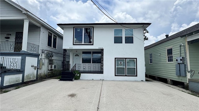 2232 Annette St, New Orleans, LA 70119 - view of front facade with stucco siding and a porch