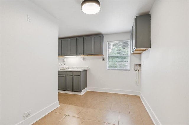 2232 Annette St, New Orleans, LA 70119 - laundry room featuring cabinet space, light tile patterned floors, and hookup for an electric dryer