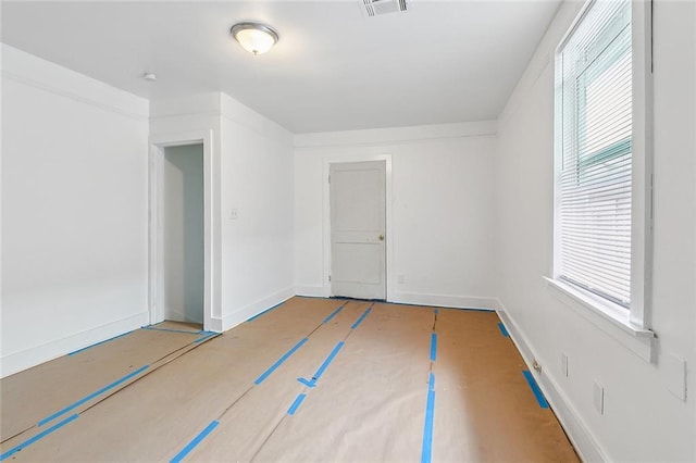 2232 Annette St, New Orleans, LA 70119 - empty room featuring plenty of natural light and a smoke detector