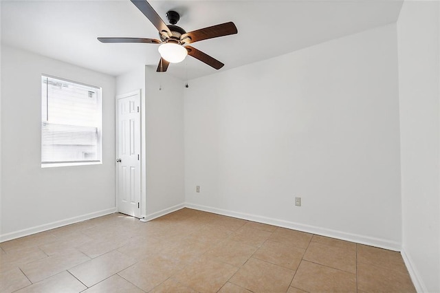 2232 Annette St, New Orleans, LA 70119 - empty room with ceiling fan and light tile patterned flooring