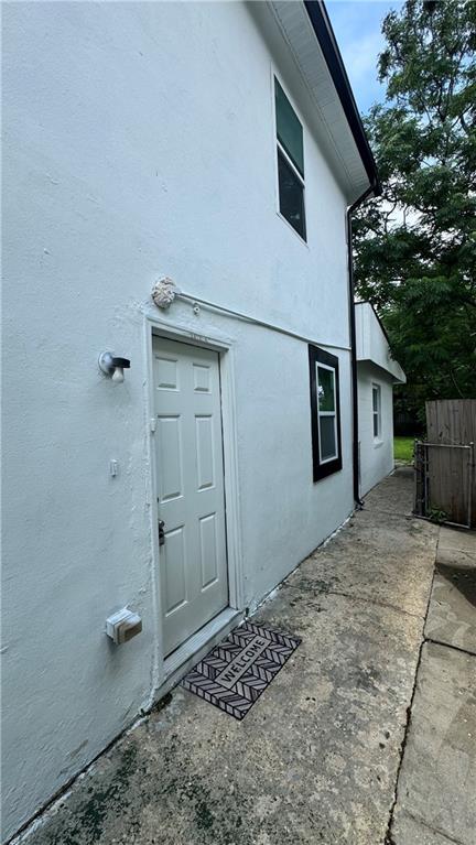 2232 Annette St, New Orleans, LA 70119 - doorway to property with stucco siding