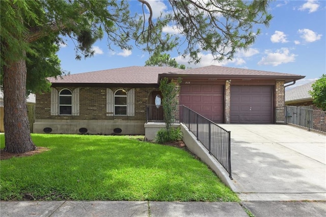 333 Bertolino Dr, Kenner, LA 70065 - ranch-style home featuring a garage, brick siding, concrete driveway, and a front lawn