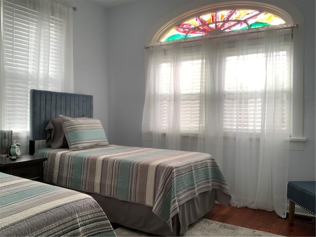3929 Octavia St, New Orleans, LA 70125 - bedroom featuring multiple windows and wood finished floors