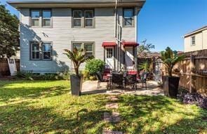 3929 Octavia St, New Orleans, LA 70125 - back of house featuring a fenced backyard and a patio