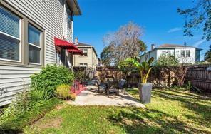 3929 Octavia St, New Orleans, LA 70125 - fenced backyard with a patio area