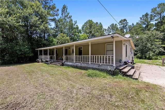 24473 Sanders Rd, Covington, LA 70435 - view of front of house with a porch and a front yard