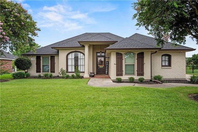 133 Oak Bend Dr, La Place, LA 70068 - view of front of home with a front lawn and roof with shingles