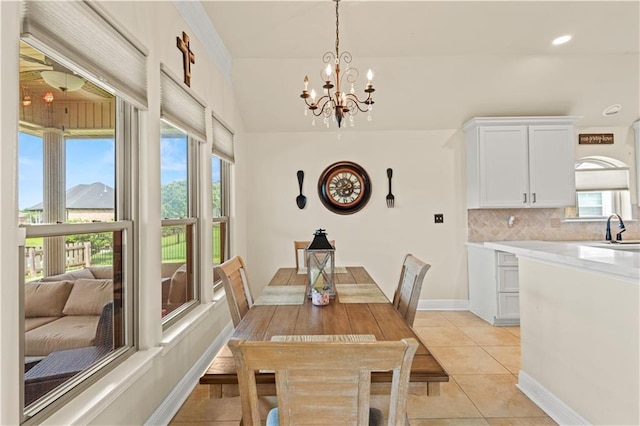 133 Oak Bend Dr, La Place, LA 70068 - dining space with healthy amount of natural light, light tile patterned floors, a chandelier, and recessed lighting