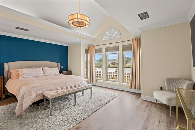 133 Oak Bend Dr, La Place, LA 70068 - bedroom with wood finished floors, ornamental molding, a water view, and high vaulted ceiling