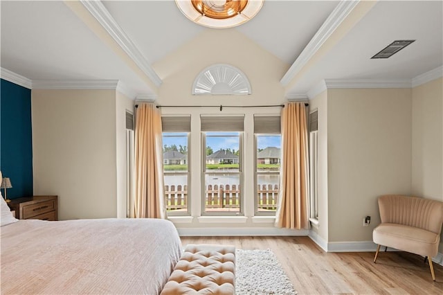 133 Oak Bend Dr, La Place, LA 70068 - bedroom featuring wood finished floors, crown molding, vaulted ceiling, and a water view