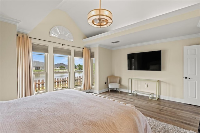 133 Oak Bend Dr, La Place, LA 70068 - bedroom featuring wood finished floors, lofted ceiling, and ornamental molding