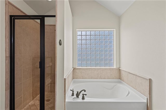 133 Oak Bend Dr, La Place, LA 70068 - bathroom featuring a bath, a stall shower, and lofted ceiling