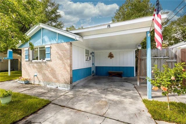 370 Cumberland Dr, Slidell, LA 70458 - view of front facade featuring brick siding and an attached carport