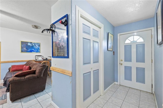 370 Cumberland Dr, Slidell, LA 70458 - entrance foyer featuring a textured ceiling and light tile patterned floors