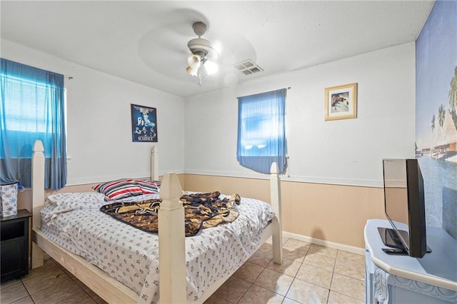 370 Cumberland Dr, Slidell, LA 70458 - bedroom featuring multiple windows, tile patterned flooring, and ceiling fan