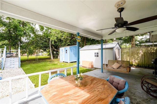 370 Cumberland Dr, Slidell, LA 70458 - view of patio / terrace with a shed, outdoor dining area, and ceiling fan