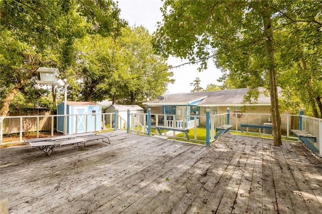 370 Cumberland Dr, Slidell, LA 70458 - wooden deck featuring a storage shed and a fenced backyard