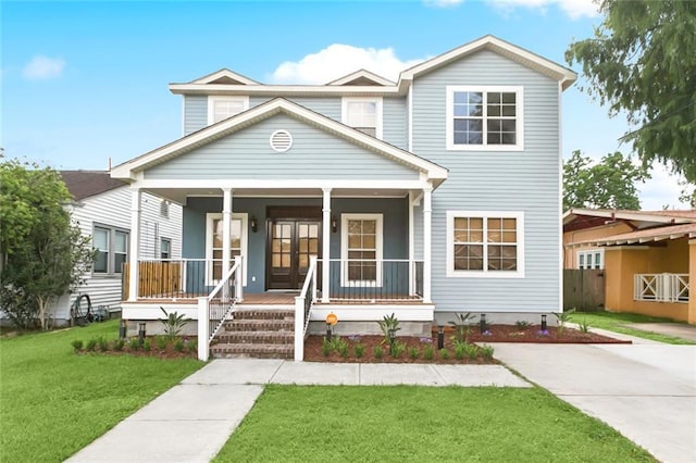 4953 Music St, New Orleans, LA 70122 - view of front of home with covered porch and a front yard