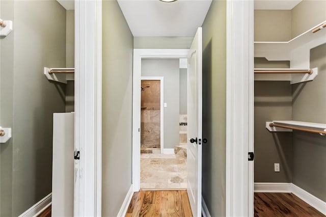 4953 Music St, New Orleans, LA 70122 - walk in closet with wood finished floors