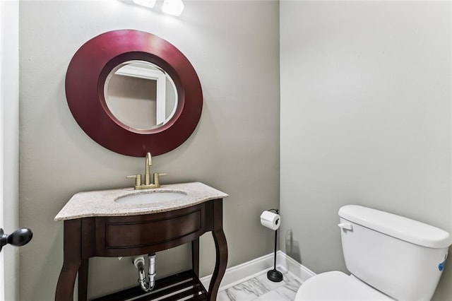 4953 Music St, New Orleans, LA 70122 - bathroom featuring a sink and marble look tile flooring