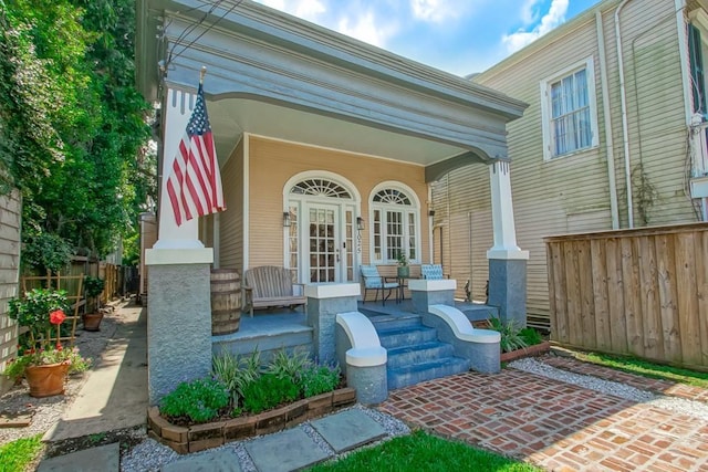 1025 General Pershing St, New Orleans, LA 70115 - view of exterior entry featuring a porch