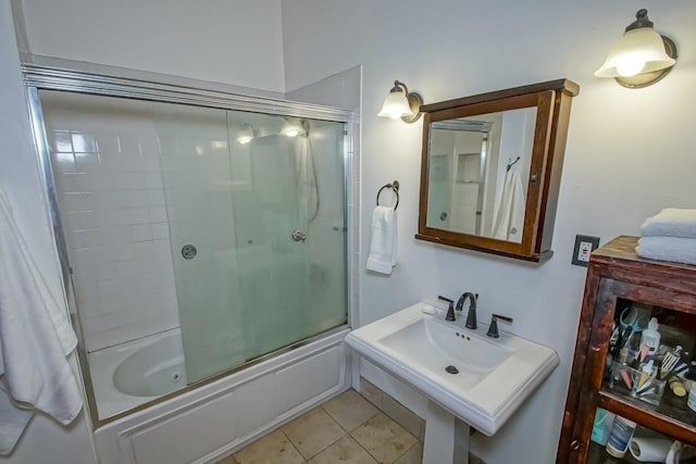 1025 General Pershing St, New Orleans, LA 70115 - full bath featuring bath / shower combo with glass door and tile patterned floors