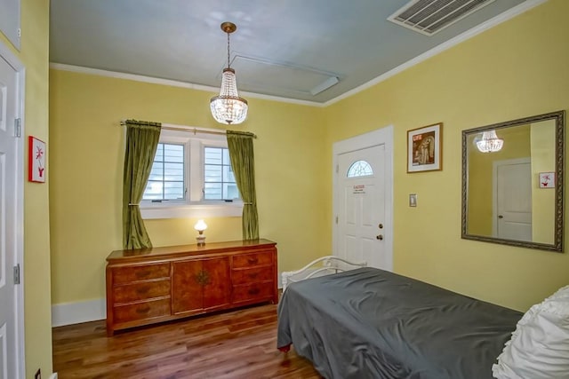 1025 General Pershing St, New Orleans, LA 70115 - bedroom featuring ornamental molding, wood finished floors, and a chandelier