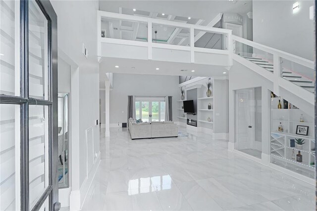 251 Oakmont Dr, New Orleans, LA 70128 - living area featuring a high ceiling, marble tiled flooring, and recessed lighting