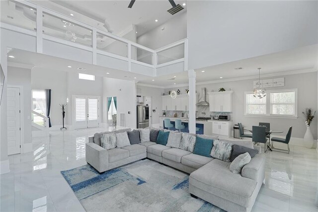 251 Oakmont Dr, New Orleans, LA 70128 - living room featuring a towering ceiling, a chandelier, recessed lighting, healthy amount of natural light, and crown molding