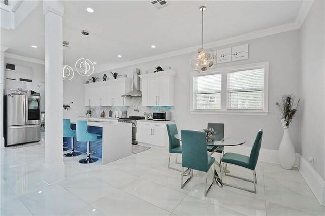 251 Oakmont Dr, New Orleans, LA 70128 - dining area featuring ornamental molding, a chandelier, light marble finish floors, and recessed lighting