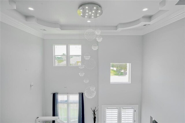 251 Oakmont Dr, New Orleans, LA 70128 - detailed view of crown molding, a tray ceiling, recessed lighting, and a chandelier
