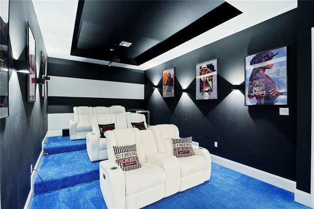 251 Oakmont Dr, New Orleans, LA 70128 - carpeted cinema room with a tray ceiling and baseboards