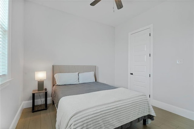 251 Oakmont Dr, New Orleans, LA 70128 - bedroom with light wood finished floors and ceiling fan
