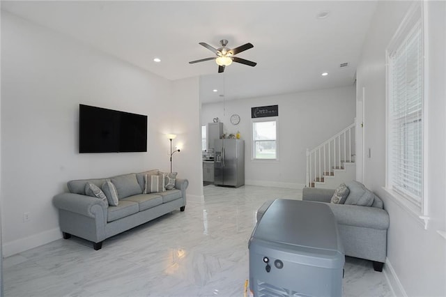 251 Oakmont Dr, New Orleans, LA 70128 - living area featuring stairs, light marble finish flooring, ceiling fan, and recessed lighting
