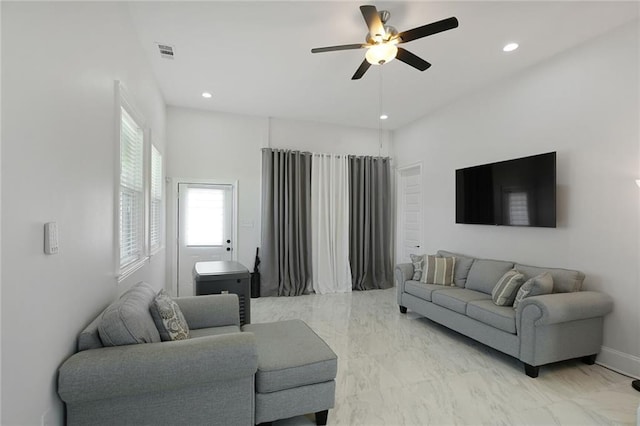 251 Oakmont Dr, New Orleans, LA 70128 - living room featuring a ceiling fan, recessed lighting, and light marble finish flooring