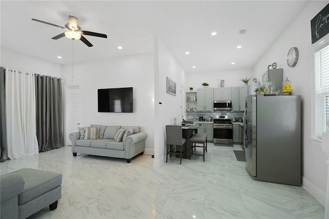 251 Oakmont Dr, New Orleans, LA 70128 - living room with a ceiling fan, recessed lighting, and light marble finish floors
