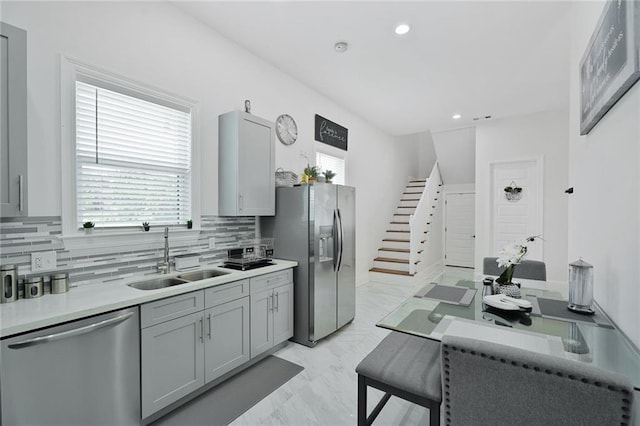 251 Oakmont Dr, New Orleans, LA 70128 - kitchen featuring stainless steel appliances, tasteful backsplash, gray cabinets, light countertops, and recessed lighting