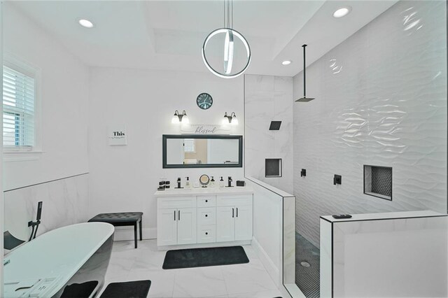 251 Oakmont Dr, New Orleans, LA 70128 - bathroom with a freestanding bath, double vanity, recessed lighting, a walk in shower, and marble look tiles