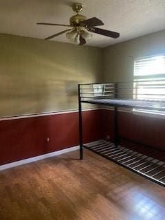 308 Elmwood Dr, La Place, LA 70068 - unfurnished bedroom featuring wood finished floors and ceiling fan