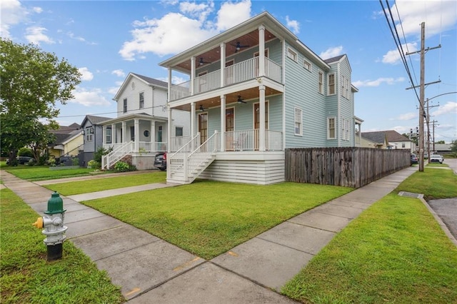 845 Pontalba St, New Orleans, LA 70124 - view of front of house with ceiling fan, a balcony, a porch, and stairway