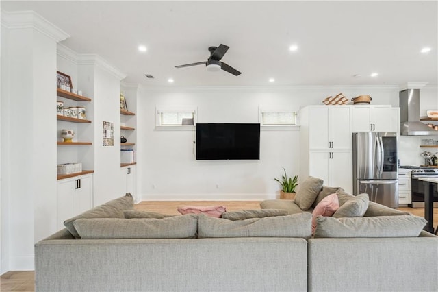 845 Pontalba St, New Orleans, LA 70124 - living area featuring light wood-style flooring, ornamental molding, ceiling fan, and recessed lighting