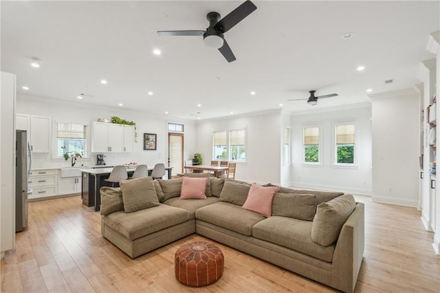 845 Pontalba St, New Orleans, LA 70124 - living area featuring a ceiling fan, ornamental molding, recessed lighting, and light wood-style floors