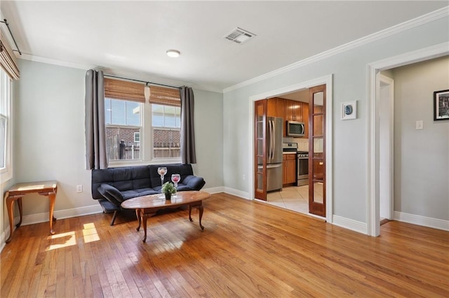 528 Carrollton Ave, Metairie, LA 70005 - living area with light wood-style floors and crown molding