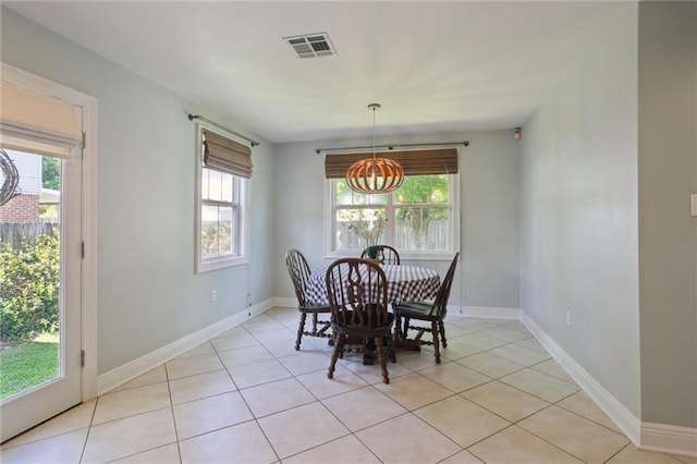 528 Carrollton Ave, Metairie, LA 70005 - dining area with a chandelier and light tile patterned floors