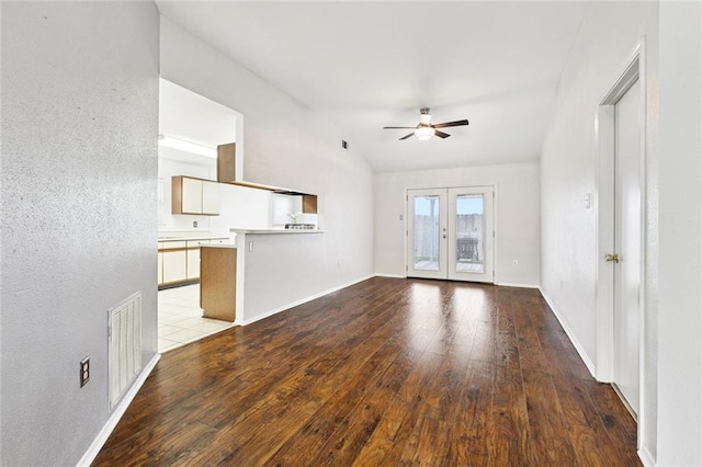 304 Jeffer Dr, Waggaman, LA 70094 - unfurnished living room with hardwood / wood-style flooring, french doors, a ceiling fan, and lofted ceiling