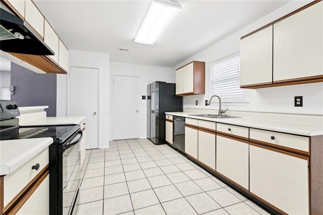 304 Jeffer Dr, Waggaman, LA 70094 - kitchen featuring black / electric stove, light countertops, freestanding refrigerator, and dishwasher